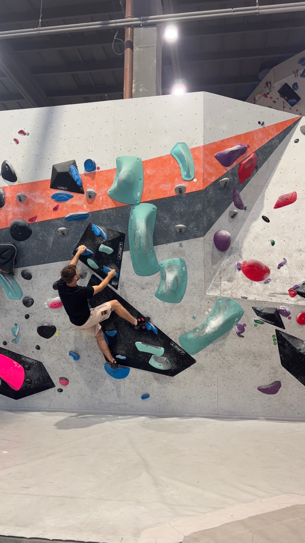 Climber on an indoor bouldering wall